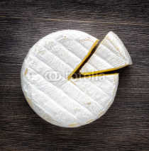 Naklejki Camembert cheese on a wooden board