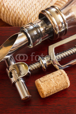 The bottle with corkscrew and wine accessories