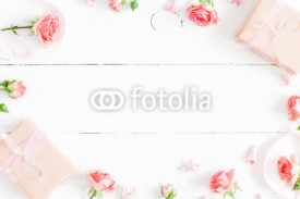 Flowers composition. Gifts and rose flowers on white wooden background. Valentine's Day. Flat lay, top view