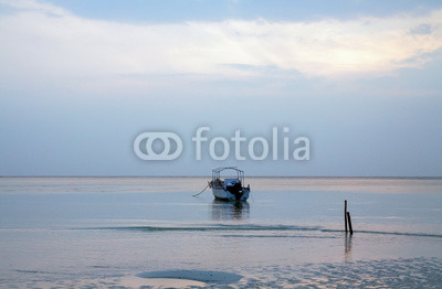 Calm sea Lowtide blue sky Dawn single Boat