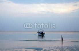 Fototapety Calm sea Lowtide blue sky Dawn single Boat