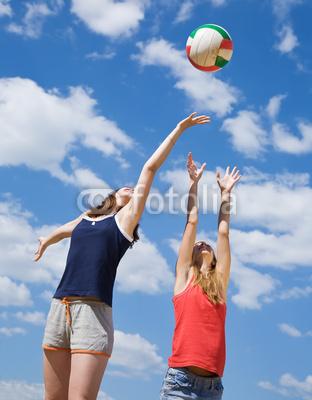 girls playing volleyball