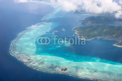 Coastline of Taha’a, French Polynesia, surrounded by coral reefs