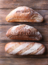 Obrazy i plakaty Fresh bread on wooden background