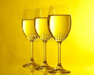 Three glasses on yeloow background