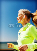 Naklejki woman doing running outdoors