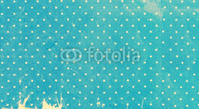 Old yellowed polka dots paper close up, background