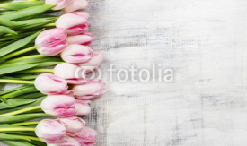 Naklejki Beautiful pink and white tulips on wooden background. Copy space