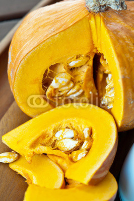 Sliced ripe yellow pumpkin. Closeup.