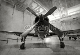 Naklejki Old airplane in a hangar