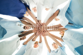 Fototapety Multiethnic Medical Team Stacking Hands