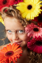 Portrait of a little girl with gerbera flowers