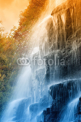amazing waterfall in the natural reserve at sunset