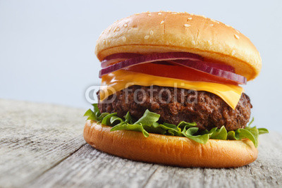 Grilled hamburger on wooden board