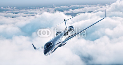 Image of black luxury generic design private jet flying in blue sky. Huge white clouds at background. Business travel concept. Horizontal . 3d rendering