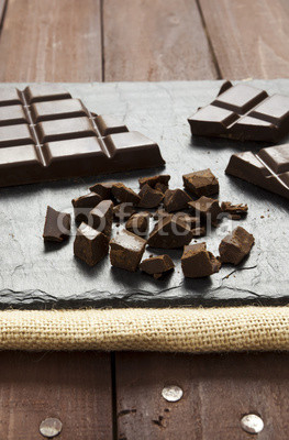 Pieces of chocolate on slate plate