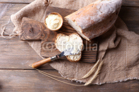 Fototapety Fresh bread and homemade butter on wooden background