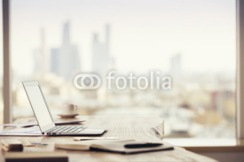 Office desktop on city background
