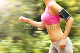Fototapety Woman jogging in the forest