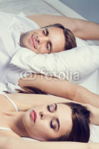 Young couple sleeping on the bed