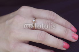 Obrazy i plakaty woman's hand with beautiful engagement ring