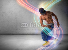 Fototapety Athletic trendy young man doing a break dance routine