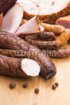 Naklejki meat products on a wooden table