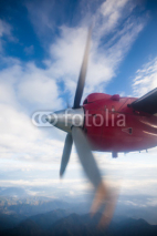 Naklejki Propeller plane in air above Himalayas