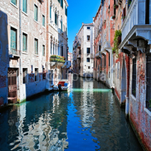 View of colored venice canal with houses in water, Italy