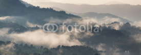 Fototapety Mountain landscape after storm. Clouds of fog. Misty village