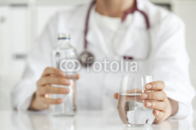 Naklejki Woman doctor with drinking water