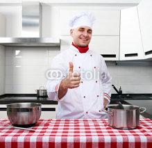 Naklejki Male chef at kitchen