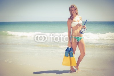 Pretty blonde holding a scuba diving gear 