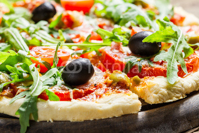 Closeup of fresh pizza with vegetables