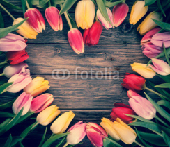 Fototapety Empty heart-shaped frame of fresh tulips