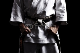 Fototapety Karate, Schwarzgurt knoten vor schwarz 01