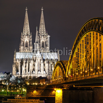 Cologne Cathedral with the Hohenzollern bridge at night