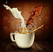Obrazy i plakaty Coffee With Milk Splashing. Cup of Cappuccino or Latte