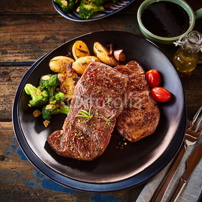 Oblong shaped plate with steak dinner