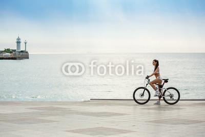 A beautiful girl on the bike
