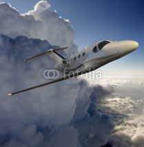 Naklejki Executive in flight near a storm