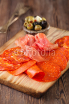 Naklejki Platter of serrano jamon Cured Meat,  chorizo and olives