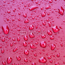 Naklejki Crystal clear water drops over red background