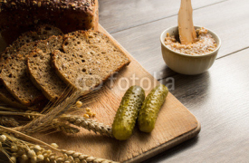 Fototapety Bread lard and pickles on old wooden cutting board