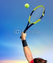 Fototapety Man Making a Tennis Serve