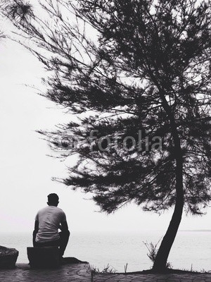 man sitting on the beach