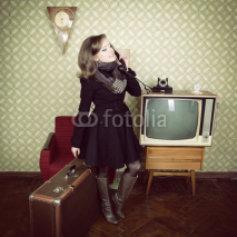 Fototapety art portrait of young woman standing in room calling phone with