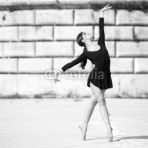 Naklejki Young beautiful ballerina dancing in Tevere riverside in Rome