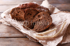 Obrazy i plakaty Fresh bread on wooden background
