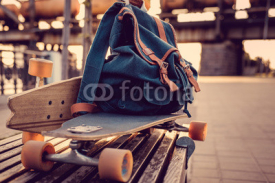 Naklejki Longboard with backpack on it.